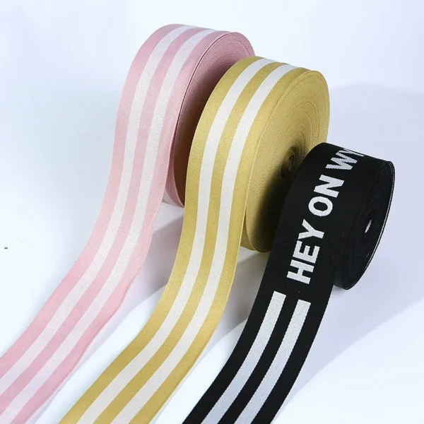 Close-up of GRS certified eco friendly recycled polyester jacquard webbing with custom woven brand logo