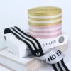Textured view of green eco friendly rPET recycled jacquard webbing ribbon for sustainable apparel trims