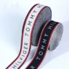 Personalized Pattern Jacquard Webbing Ribbon for Clothing & Fashion Accessories A detailed close-up shot of colorful personalized pattern jacquard webbing ribbon showing intricate woven geometric design and rich fabric texture.