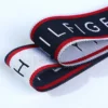 Personalized Pattern Jacquard Webbing Ribbon for sportswear Macro photograph showcasing the double-sided pattern weave and clean edge stitching on a high-density jacquard ribbon tape.