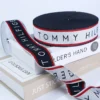Personalized Pattern Jacquard Webbing Ribbon for trousers A fashionable canvas tote bag featuring a personalized jacquard woven ribbon as a stylish shoulder strap and decorative trim.